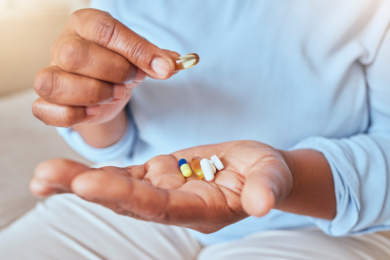 person holding pills in palm