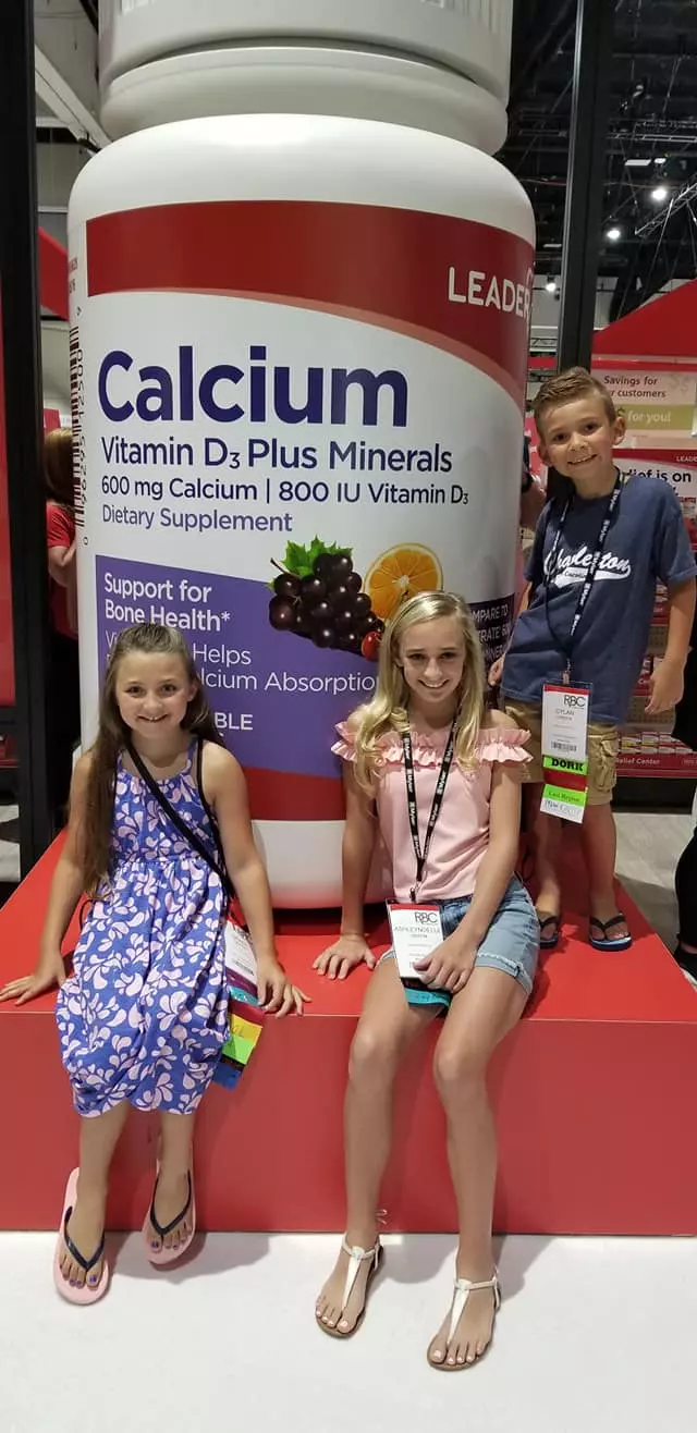 kids posing with Calcium bottle